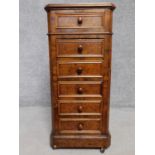 A 19th century Continental burr walnut marble topped bedside chest of four drawers with hinged