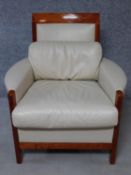 A cherrywood framed Giorgetti armchair with white leather upholstery. H.89cm