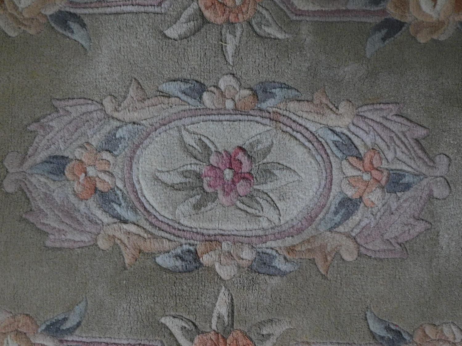 A Chinese rug with central floral medallion set on a pastel field within floral borders 144x63cm - Image 2 of 4