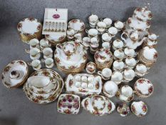 A twelve person Royal Albert gilded dinner service. Old Country Rose pattern. Including egg cups,