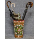 A hand painted umbrella stand together with six vintage umbrellas. H.45cm