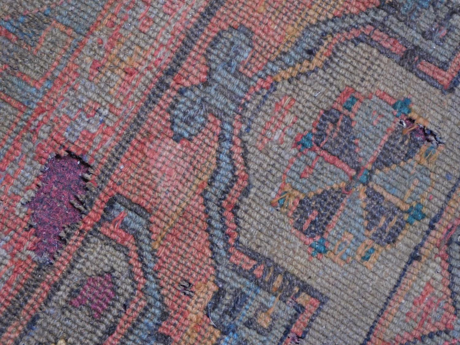 A Persian rug with repeating multicolour diamond motifs surrounded by repeating geometric borders - Image 5 of 6