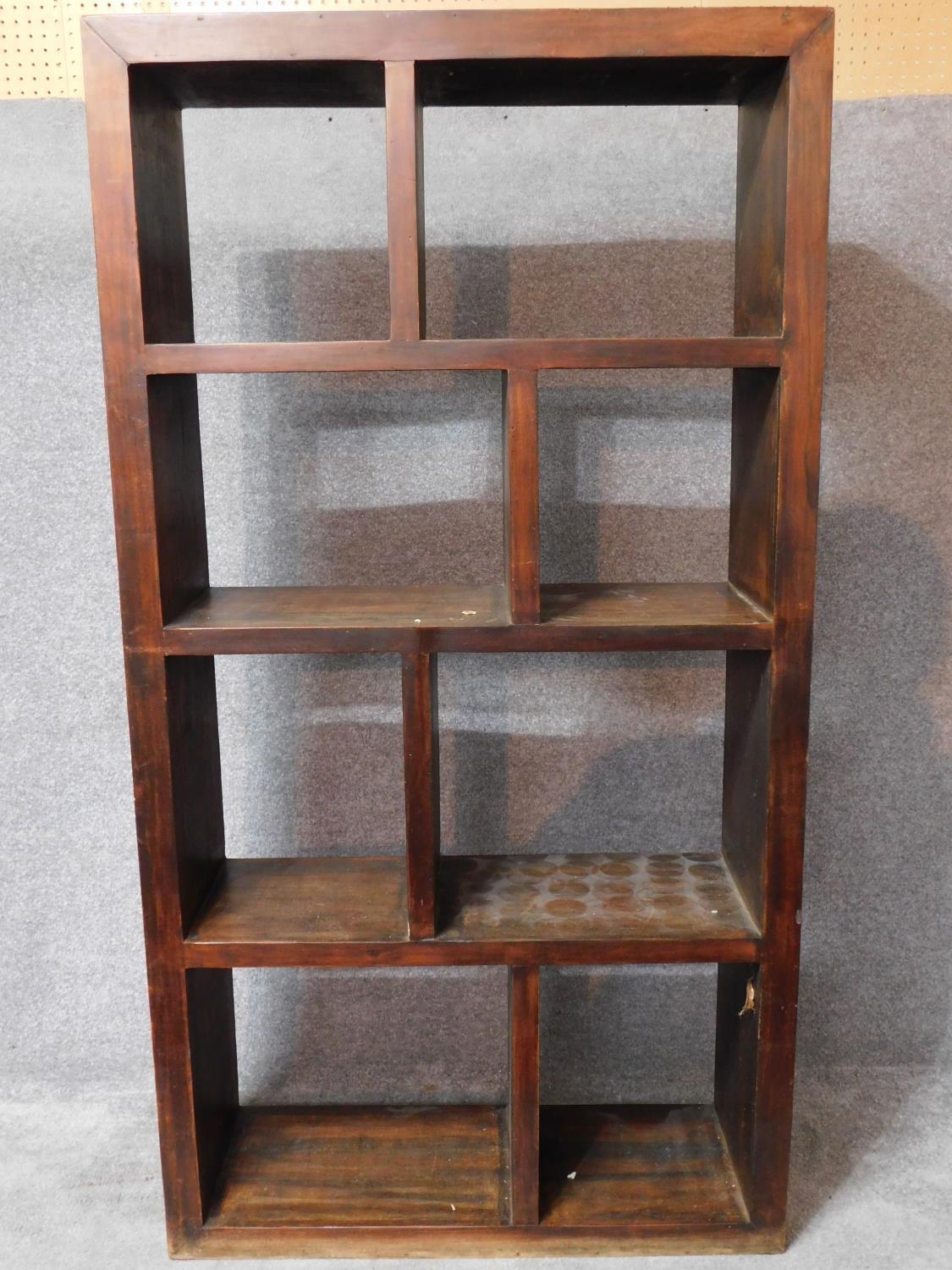 An Eastern teak open bookshelf. H.107 W.100 D.35cm