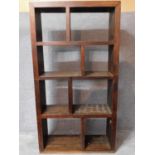 An Eastern teak open bookshelf. H.107 W.100 D.35cm