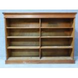 A 20th century walnut open bookcase on plinth base. H.124 W.177 D.42cm