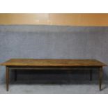 An antique country refectory dining table on square tapering supports. H.76 W.287 D.84cm