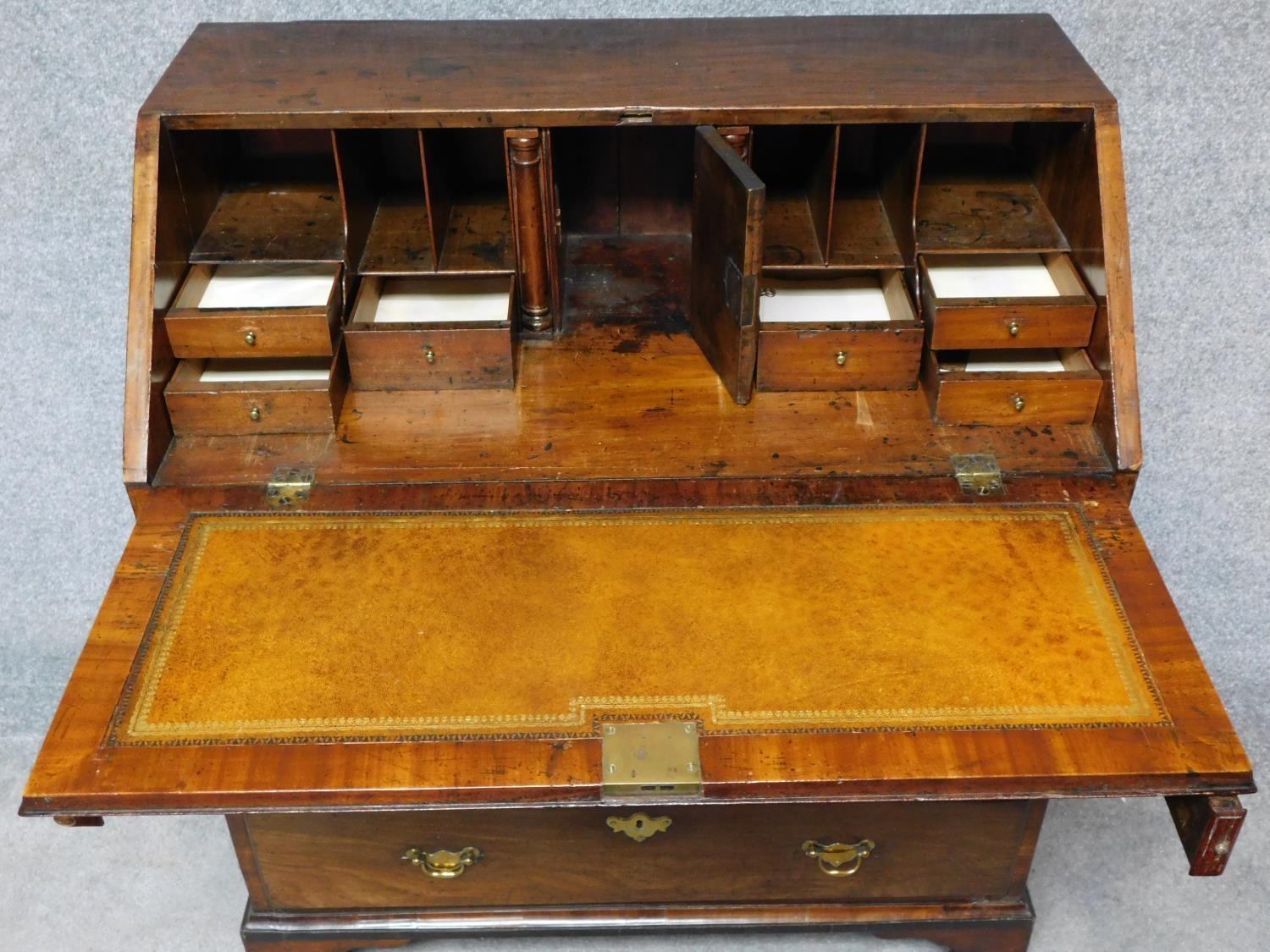 A Georgian mahogany bureau with fitted interior above two short over three long graduating drawers - Image 4 of 7