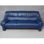 A contemporary World of leather three seater sofa in blue leather upholstery. H.80 W.205 D.83cm