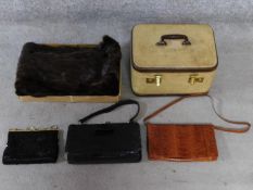 A collection of vintage bags, one alligator, a canvas and leather travelling jewellery case with