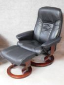 A black leather upholstered 'Stressless' Ekornes adjustable revolving armchair with matching