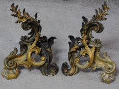 A pair of French Rococo style gilded bronze acanthus leaf chenets. H.30cm