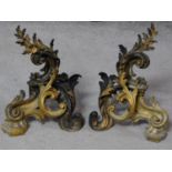 A pair of French Rococo style gilded bronze acanthus leaf chenets. H.30cm