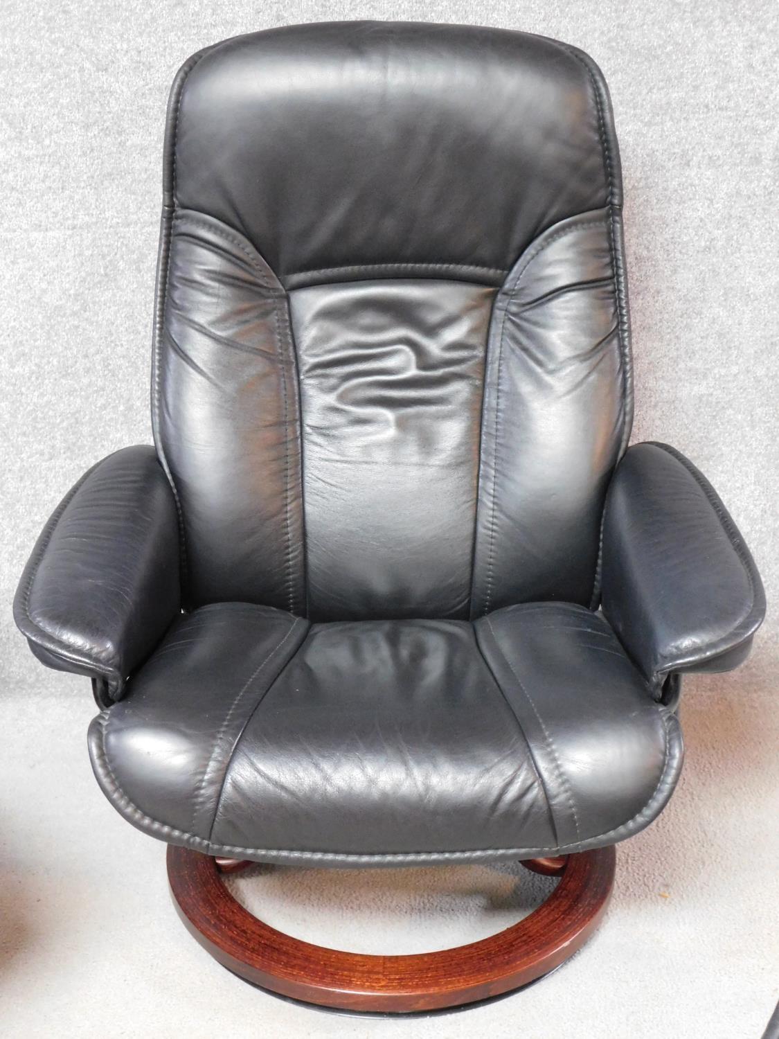 A black leather upholstered 'Stressless' Ekornes adjustable revolving armchair with matching - Image 2 of 5