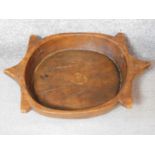 A vintage African yellow wood bowl with carved abstract design and engraved detailing. 57x41cm