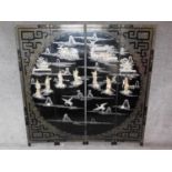 A Japanese mother of pearl and bone inlaid black lacquered three fold and four panel screen. H.183