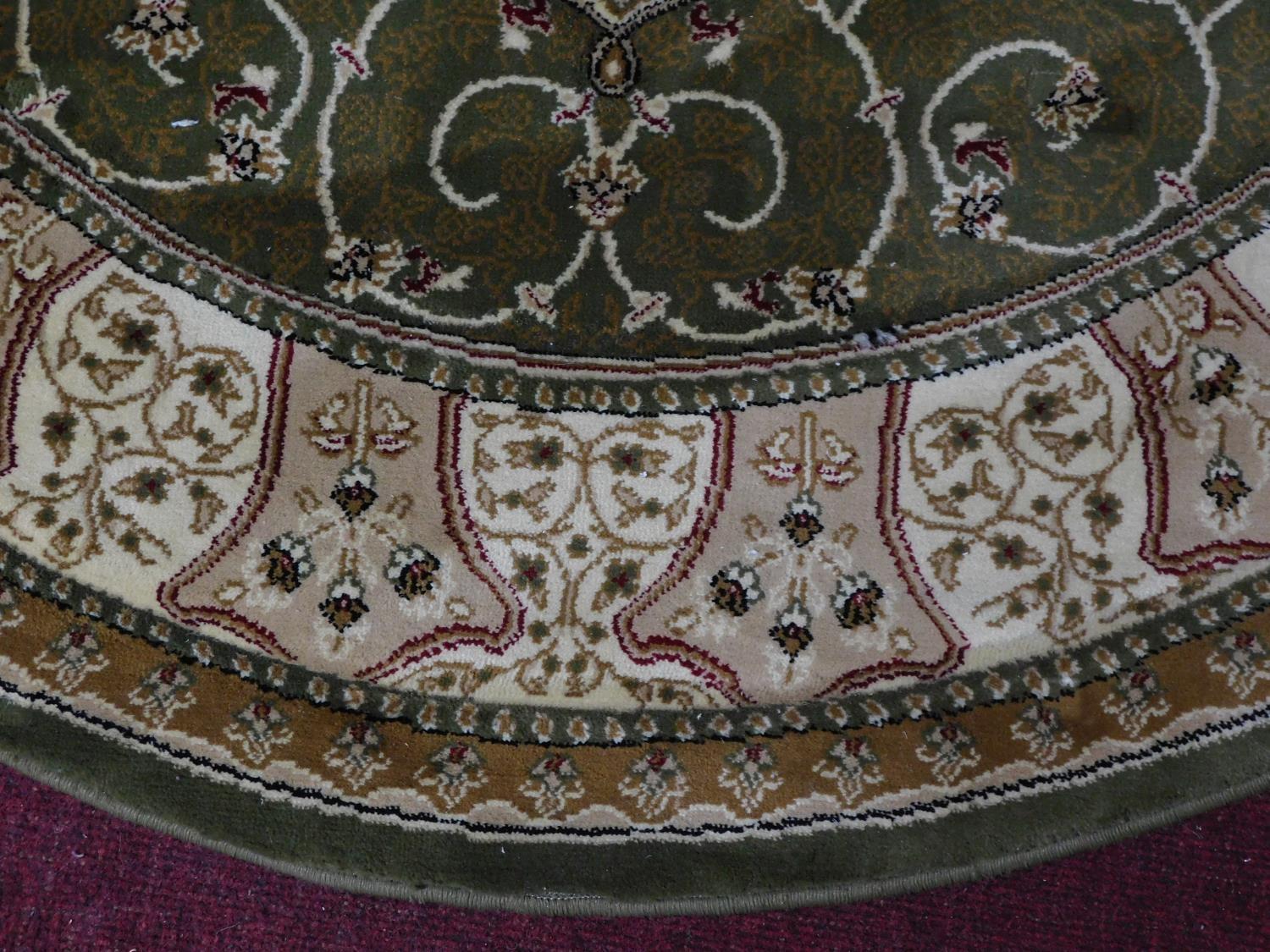 A circular Eastern rug with central pendant medallion on a green and ivory field 150x150cm - Image 3 of 5