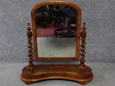 A 19th century walnut swing dressing mirror with original glass plate. H.66cm