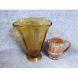 A vintage amber art glass trumpet vase and a vintage Italian ceramic jug by Elbee, stamped made in