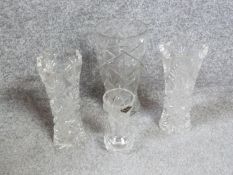 Four handcut crystal vases. A matching pair with star design, a large star cut vase and a smaller