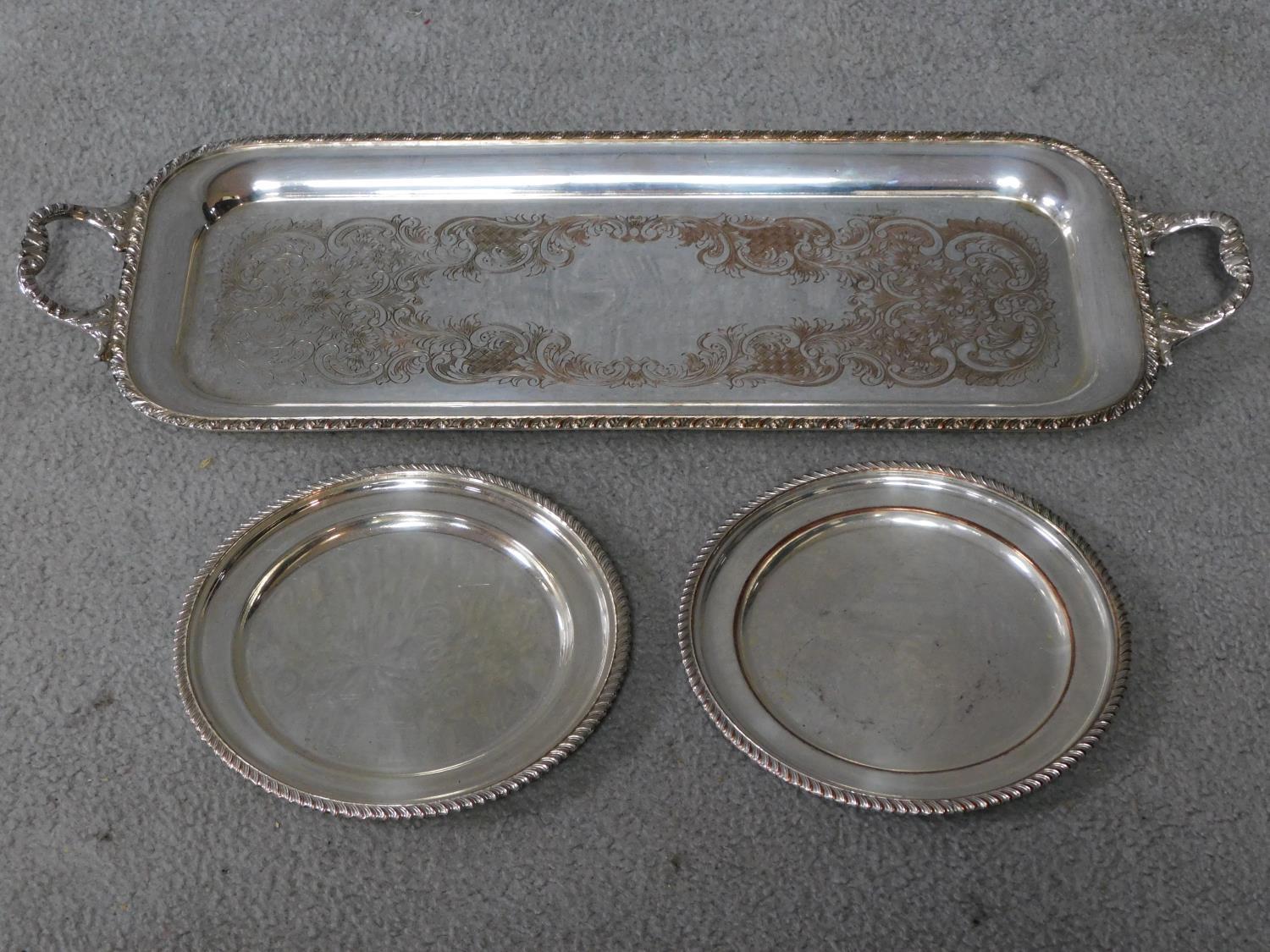 Two silver plated trays with rope effect borders, stamped to reverse with a chicken, fleur de lis