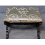 A William IV rosewood framed silk upholstered foot stool on carved stretchered supports. H.40 W.59