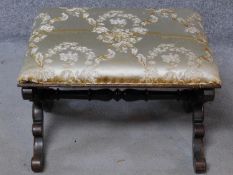 A William IV rosewood framed silk upholstered foot stool on carved stretchered supports. H.40 W.59