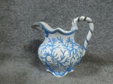 A Georgian hand painted ceramic serpent seaweed pitcher By E. Jones, Cobridge. Stamped to base '