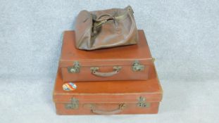 A collection of vintage leather luggage. Including two leather suitcases, one with a patterned