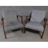 A pair of teak framed vintage style armchairs in grey upholstery. H.73cm