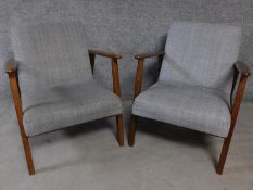 A pair of teak framed vintage style armchairs in grey upholstery. H.73cm