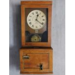 An antique oak wall hanging clocking-in clock by Gledhill-Brook-Time-Recorder Ltd. H.99 W.40 D.30cm