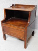 A Georgian mahogany night table with folding shelf and panel enclosing compartment on square