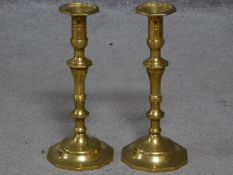 A pair of vintage brass candlesticks with faceted geometric bases. H.25cm