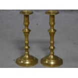 A pair of vintage brass candlesticks with faceted geometric bases. H.25cm