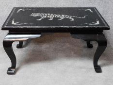 An Eastern black lacquered with mother of pearl inlay coffee table on cabriole supports. H.48 L.91