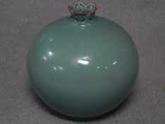 A 20th century Korean Blue celadon crackle glaze pomegranate vase with pierced neck. Artist's