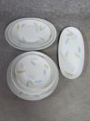 A Rosenthal mid century porcelain leaf design serving platter, graduating oval serving dishes and