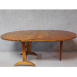 A vintage fruitwood vineyard folding table with a custom made leaf on stretchered supports. H.70 W.