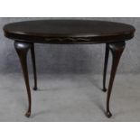 A Georgian style 20th century mahogany oval occasional table raised on cabriole supports. H.67 L.