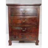 An Eastern hardwood chest with an arrangement of five drawers on cabriole supports. H.113 W.87 D.