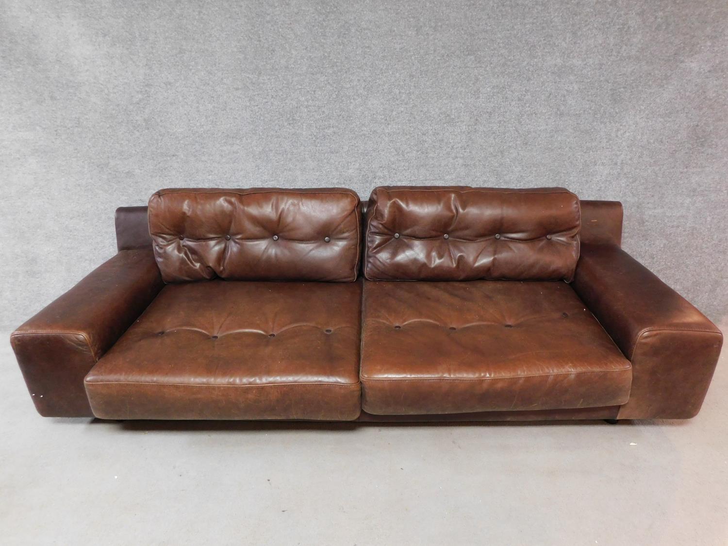 A vintage style brown leather button back two seater sofa retailed by Habitat. H.65 W.236 D.90cm