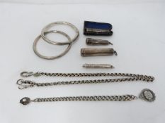 A collection of silver items. Including a pair of silver bangles, a silver fancy link watch chain