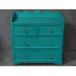 A 19th century painted pine chest of two short over two long drawers with shaped galleried back. H.