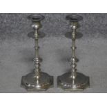 A pair of Napoleon III style silver plated candlesticks with octagonal bases. H.24cm