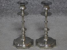 A pair of Napoleon III style silver plated candlesticks with octagonal bases. H.24cm