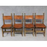 A set of four antique oak dining chairs with tan leather seats and backs on square stretchered