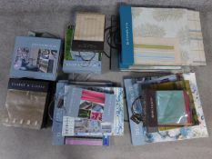 A collection of seventeen fabric swatch books mostly from the Designers Guild, Clarke & Clarke and