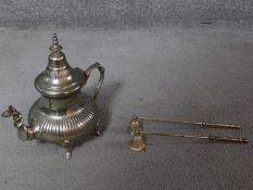 A silver plate Moroccan tea pot and two silver plate candle snuffers. H.26cm
