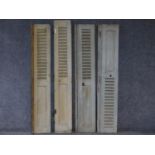 A set of four distressed painted louvre shuttered folding doors. H.171 W.52cm (each)