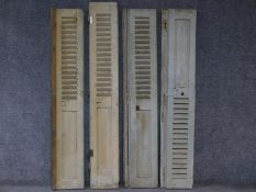 A set of four distressed painted louvre shuttered folding doors. H.171 W.52cm (each)